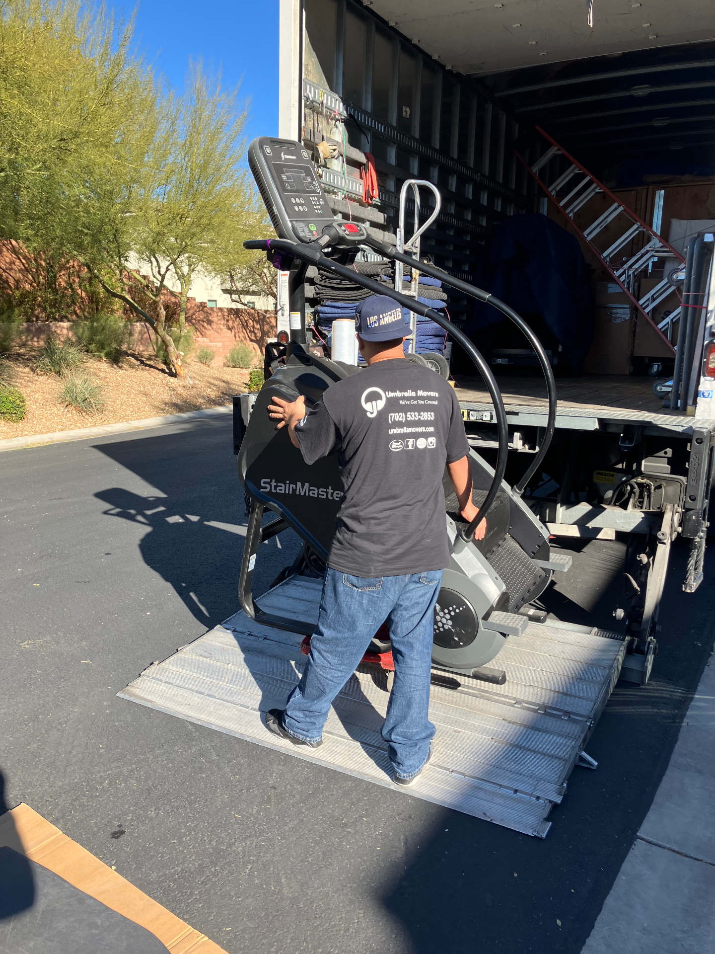 Loading StairMaster gym equipment onto truck