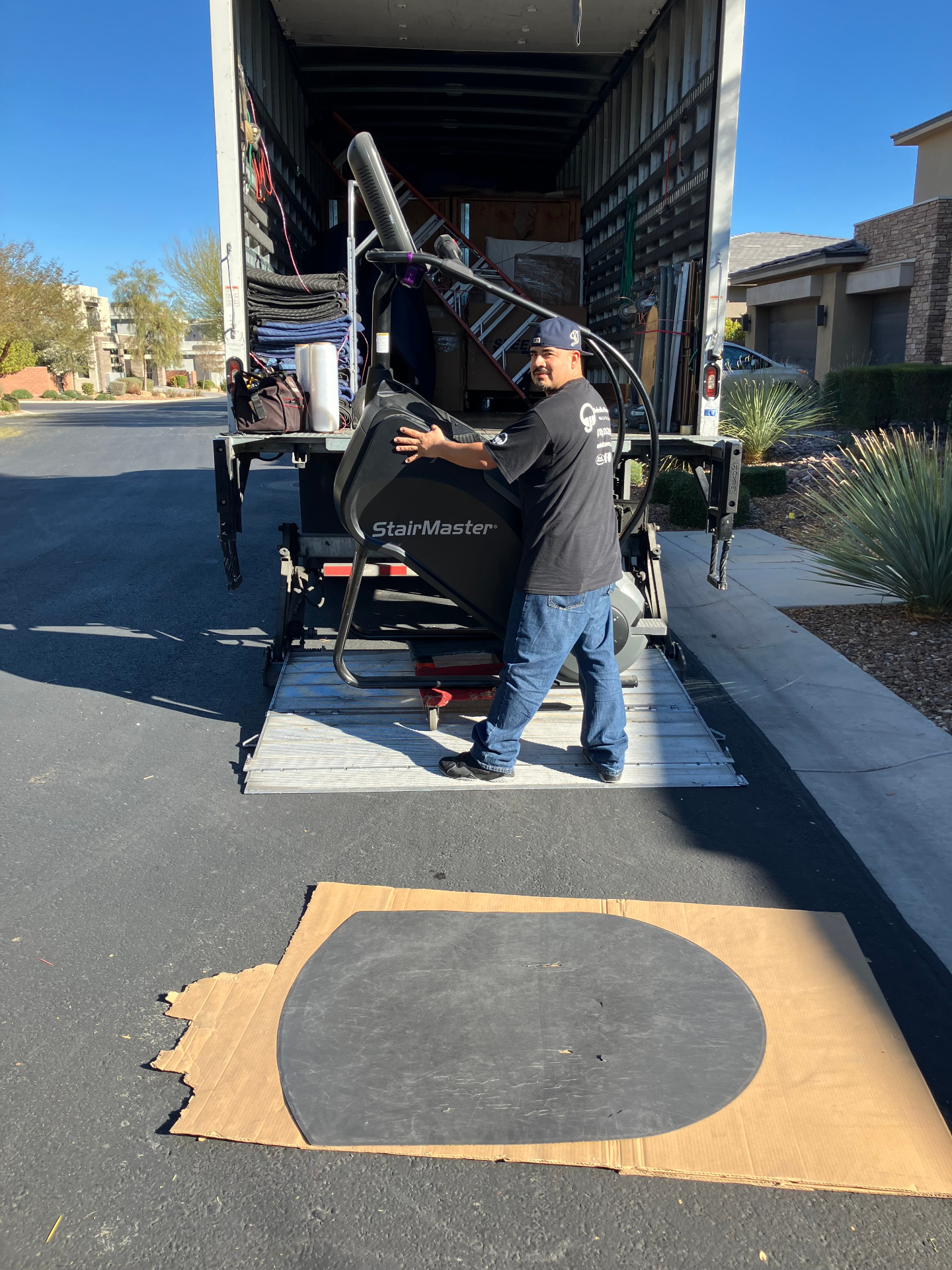 Mover unloading StairMaster with protective mat