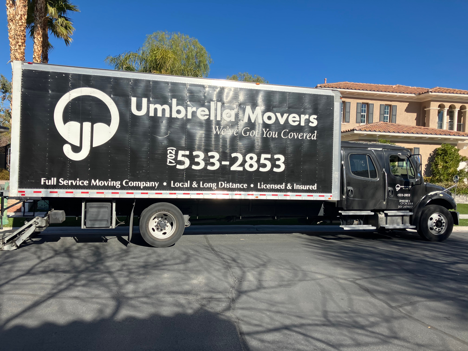 Umbrella Movers truck at The Ridges luxury home